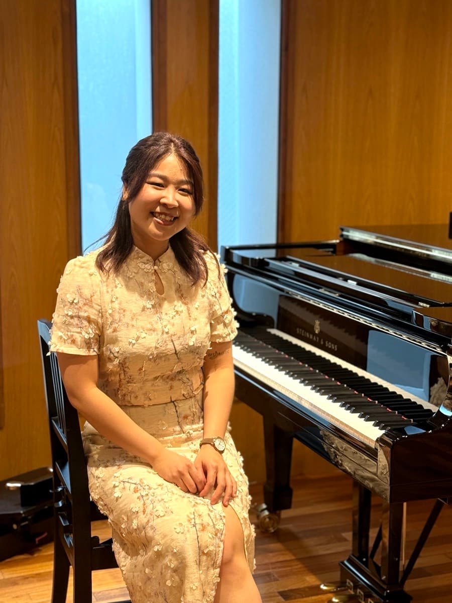 Kathrine Leong beside the concert grand on the day of the Spring Concert